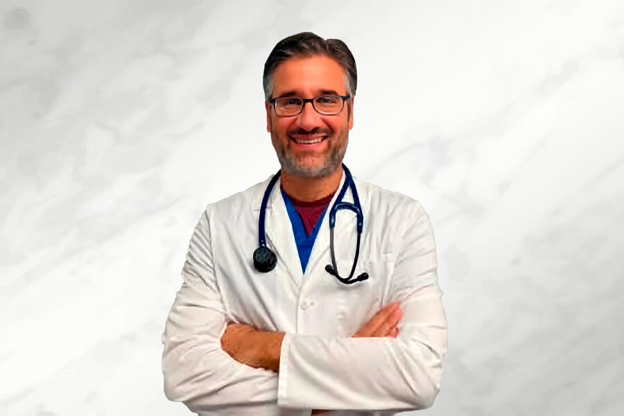 A man in white lab coat and stethoscope.